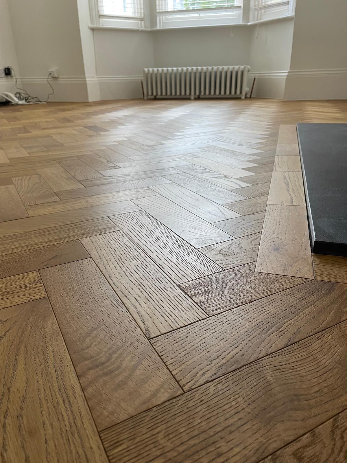 A newly fitted hardwood floor in a warm living space